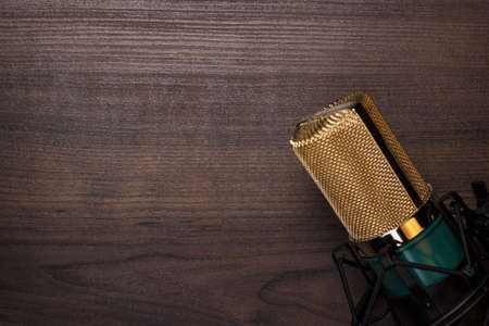 vintage condensing microphone on the wooden backgroundの写真素材