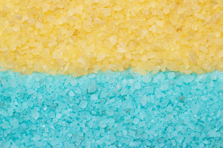 blue and yellow aromatic bath salt backgroundの写真素材