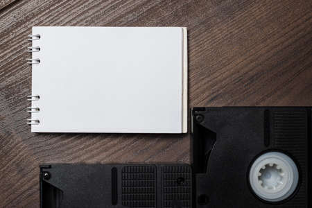 old retro video tape over wooden backgroundの写真素材