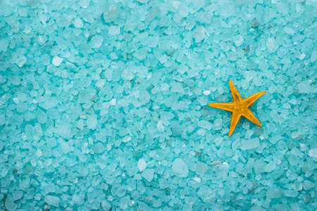 blue aromatic bath salt and starfish backgroundの写真素材