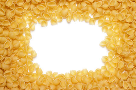 uncooked macaroni background with copy space in the middleの写真素材