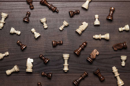 chess figures on the brown woden tableの写真素材