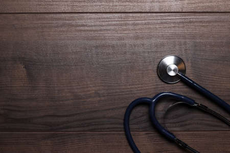 statoscope on the brown wooden table backgroundの写真素材
