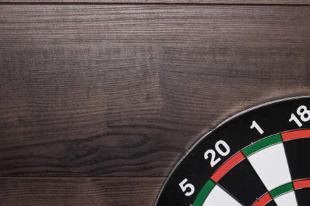 target on the brown wooden table backgroundの写真素材