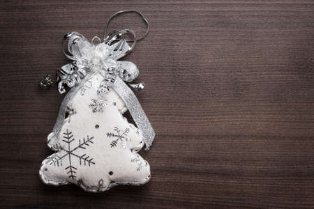 handmade toy christmas tree on the brown wooden backgroundの写真素材