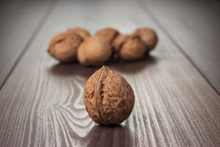 walnuts on the brown wooden table background