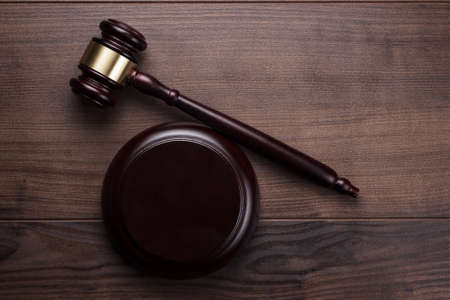 judge gavel on the brown wooden background
