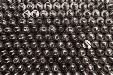 new bolts on the wooden table background