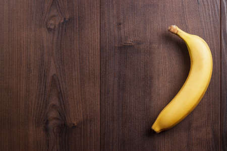 fresh ripe banana on the brown wooden の写真素材