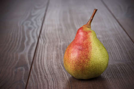 fresh pear on the brown wooden tableの写真素材