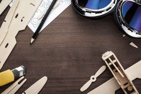 handmade airplane on the brown wooden table