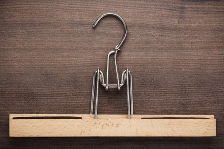 clothing hanger on the brown wooden table