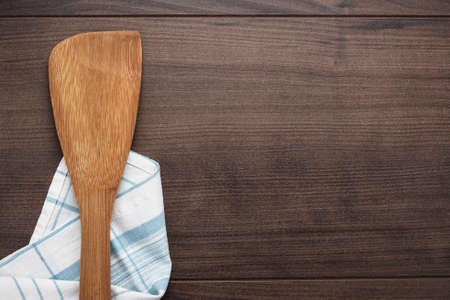 wooden spatula on the brown table backgroundの写真素材