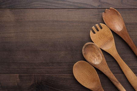 different wooden spoons on the blue tableの写真素材
