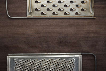 natural aged old rusted grater on the wooden tableの写真素材