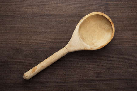 old wooden spoon on the blue tableの写真素材