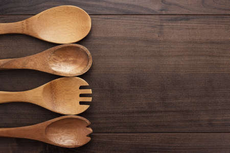 different wooden spoons on the blue tableの写真素材