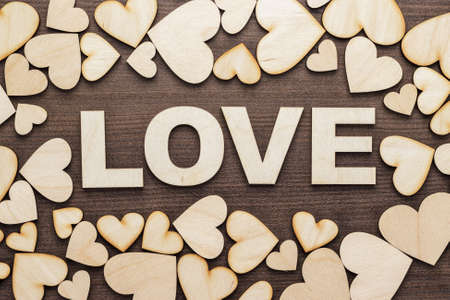 word love made up with wooden letters on the tableの写真素材