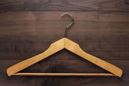clothing hanger on the brown wooden tableの写真素材