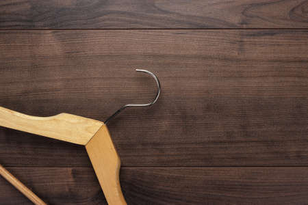 clothing hanger on the brown wooden tableの写真素材