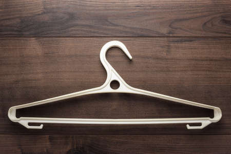 clothing hanger on the brown wooden tableの写真素材