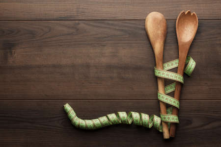 different wooden spoons on the blue tableの写真素材