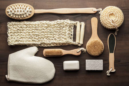 some bath accessories on the brown wooden backgroundの写真素材