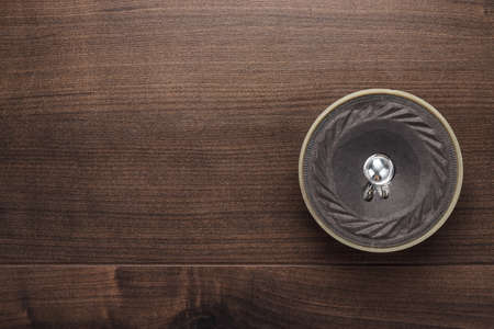 old loudspeaker on the brown wooden table