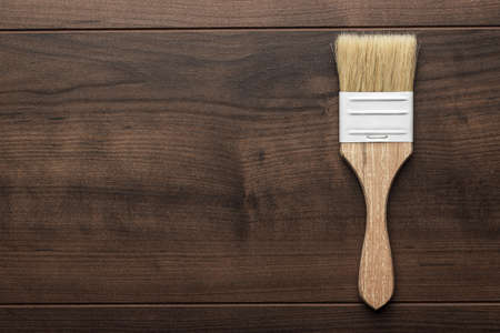 paint brush on the brown wooden tableの写真素材