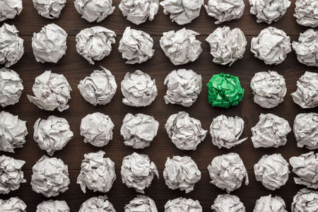 great idea concept. crumpled paper on the wooden tableの写真素材