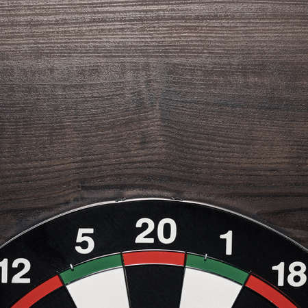 target on the brown wooden table backgroundの写真素材