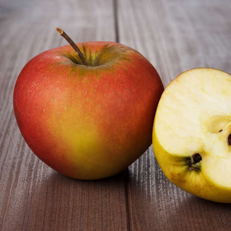 fresh red apples on the wooden tableの写真素材