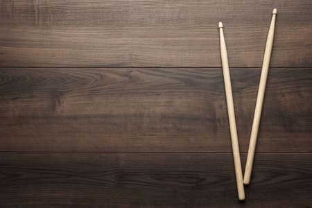 pair of wooden drumsticks on wooden tableの写真素材