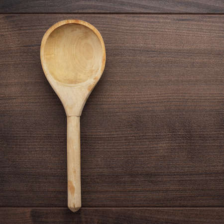 old wooden spoon on the blue tableの写真素材