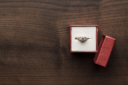 ring in the red box on wooden tableの写真素材