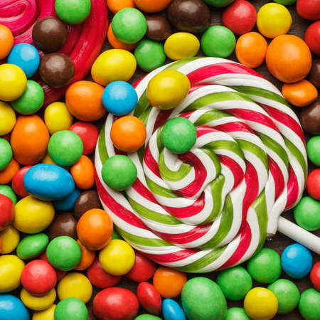 different colorful sweets and lollipops on the table
