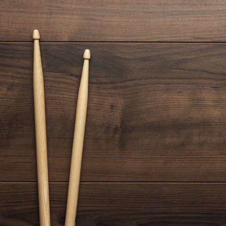 pair of wooden drumsticks on wooden tableの写真素材