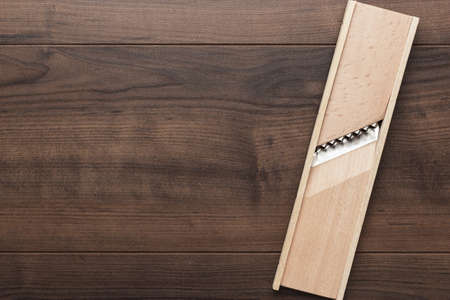 retro wooden shredder on the brown tableの写真素材