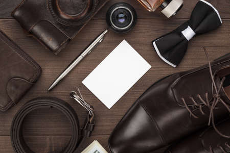 men's accessories on the brown wooden table
