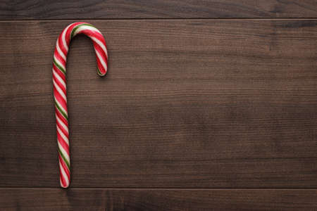red sugar lollipop on the wooden table