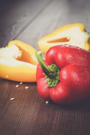 sweet peppers on the brown wooden tableの写真素材