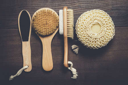 some bath accessories on the brown wooden backgroundの写真素材