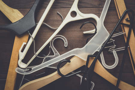 clothing hanger on the brown wooden tableの写真素材