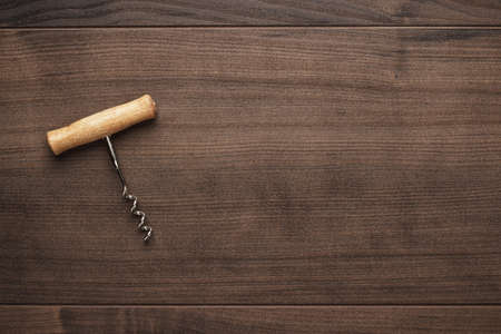 retro wooden corkscrew on the brown tableの写真素材