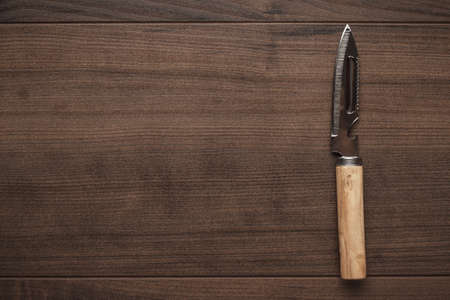 multifunctional kitchen knife on the wooden tableの写真素材