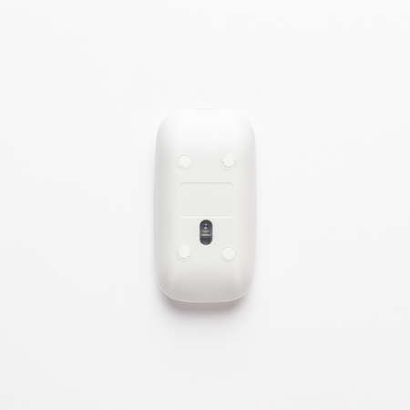 wireless computer mouse upside down on white background. not isolatedの写真素材