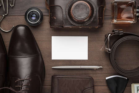 mens accessories and blank business card mockup on the brown wooden tableの写真素材