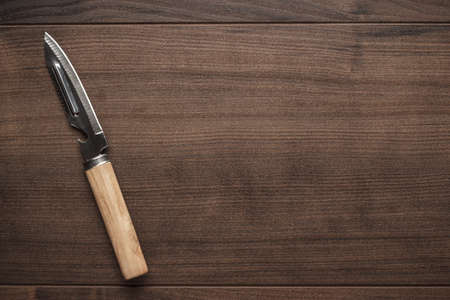 multifunctional kitchen knife on the wooden tableの写真素材