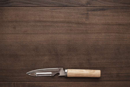 multifunctional kitchen knife on the wooden tableの写真素材