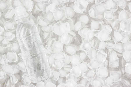 plastic water bottle is cooling in the iceの写真素材